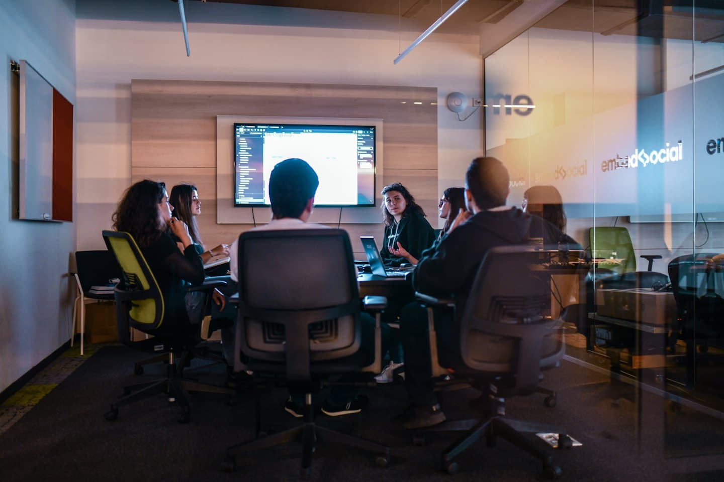 Diverse team collaborating in a modern office conference room.